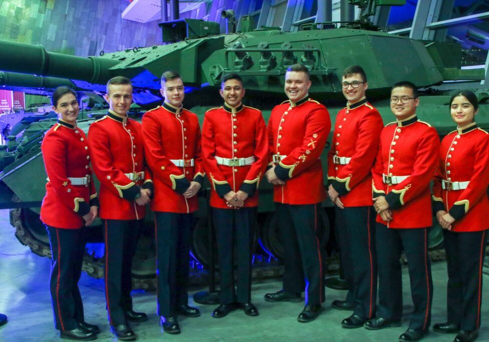 RMC Debate and International Affairs Society in front of tank display