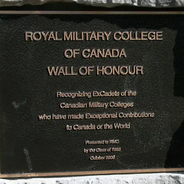 A bronze plaque reads “Royal Military College of Canada Wall of Honour” and recognises ex-cadets who made exceptional contributions to Canada or the world. It was presented in October 2008 by the Class of 1983.
